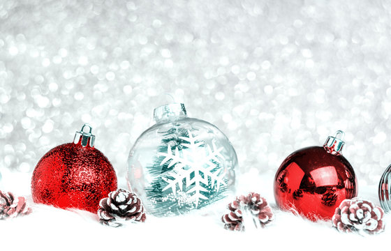 Christmas decoration ball on white fur at silver bokeh light background,Holiday greeting card