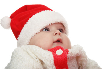 Beautiful child wear red and white Christmas Santa hat isolated on white background.