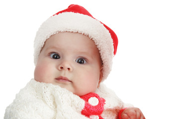 Beautiful child wear red and white Christmas Santa hat isolated on white background.