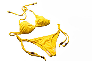 Yellow bikini on white background