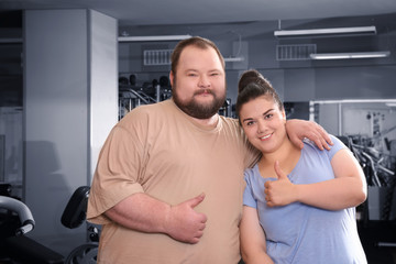 Overweight couple in gym