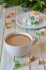 Coffee with milk, pistachios and Turkish Delight