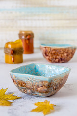 Obraz na płótnie Canvas Ceramic bowls handmade. Clay cups blue and brown colours