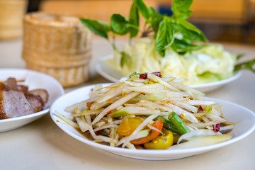 Papaya salad with pickled fish sauce, This dish eat with sticky rice, grilled pork and fresh vegetable, Thai food
