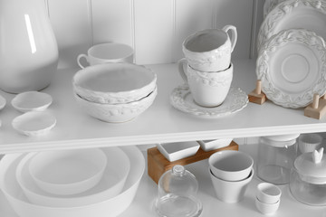 Storage stand with tableware indoors