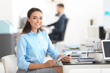 Young beautiful woman in office © Africa Studio