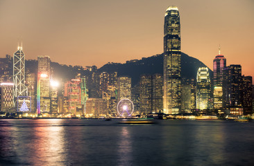 Hong Kong skyline view from kowloon side,colorful night life cityscape with water reflection