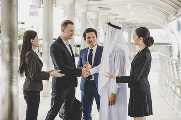Business people shaking hands, finishing up meeting deals. Business concept.