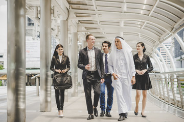 Fototapeta premium Business partners team walking down and discussing work.
