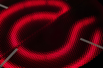 The red-hot red-burner induction hob close up.