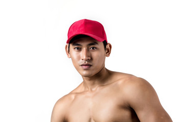 Young handsome fit man posing his muscles isolated on white background with copyspace.