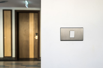 light switch on white wall and door room
