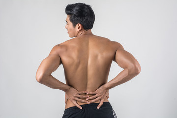 Obraz premium Close up of man rubbing his painful back isolated on white background.