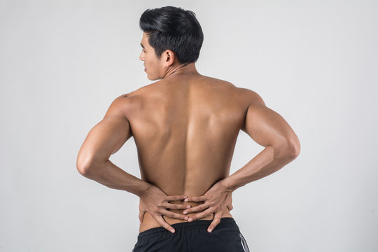 Close Up Of Man Rubbing His Painful Back Isolated On White Background.