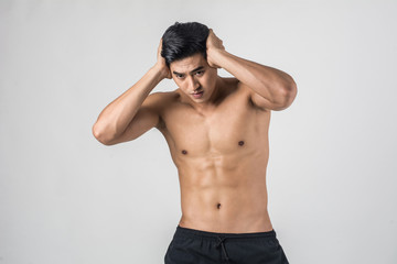 Fototapeta premium Young handsome Muscular man has headache isolated on white background.