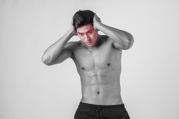 Young handsome Muscular man has headache isolated on white background.