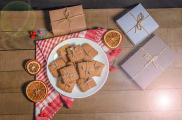 Biscuits, red napkin; gifts; Christmas decor with free space for text. Top view