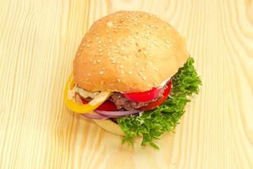 Traditional hamburger on a wooden surface