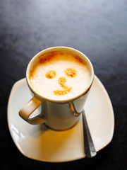 Smile face drawing on coffee