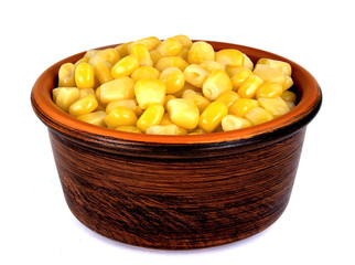 Sweet corn kernels in bowl over white