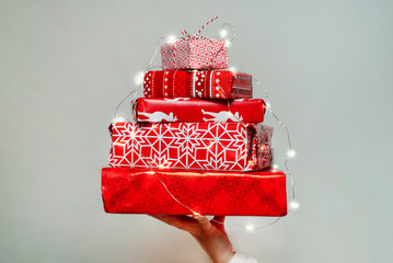 Pile of packed christmas gifts on white background
