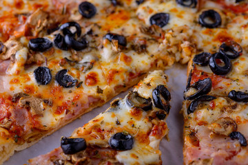 Tasty pizza with bacon, olive, basil