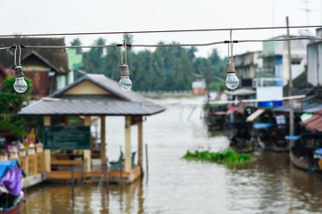 Fototapeta na wymiar Lamps over the Amphawa Canal.Thailand.