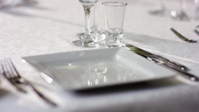 View of an empty plate and fork with knife on table at restaurant