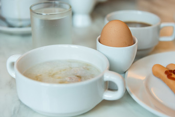 Obraz na płótnie Canvas Rice gruel breakfast on table.