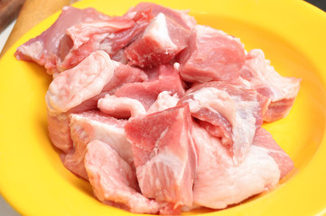 Raw chopped pork on the cutting board close-up. Process of cooking