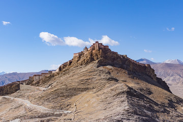 Gyantse Dzong fortress. It is one of the best preserved dzongs in Tibet, perched high above the town of Gyantse on a huge spur of grey brown rock - Tibet