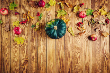 yellow pumpkin on old weathered wooden background