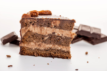 chocolate cake with chocolate broken isolated on white