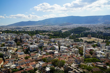 Fototapeta na wymiar Panoramic view of Athens city from Acropolis seeing ancient ruin, building architecture, trees, mountain and bright sky background