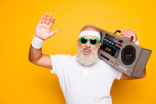 Yeah bro! What`s up? Cheerful excited aged funny sexy gangster cool grandpa dude in eyewear with bass clipping ghetto blaster recorder. Old school, swag, fooling, gym, technology, success, hip hop