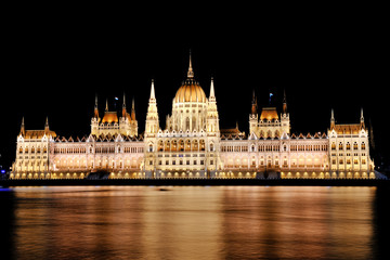 Budapest, Hungary - scenic view of the Parliament and Danube river at night