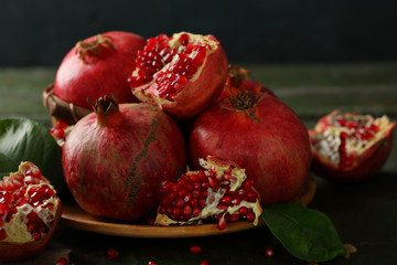 Fresh pomegranate on dark background