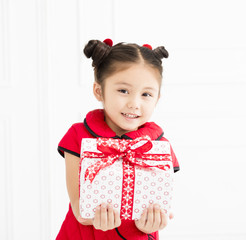 little girl showing gift for chinese new year.