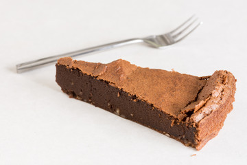 Flat lay above chocolate cake on the white marble background