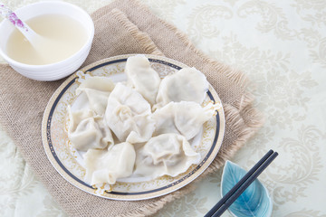 JiaoZi, Chinese dumpling on a plate, closeup.