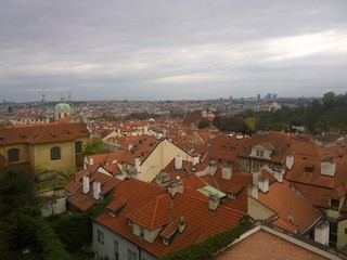 Fototapeta premium Panorama view of tile roofs in a historical part of Prague