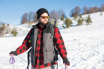 Fototapeta na wymiar Man exploring the snow covered mountain