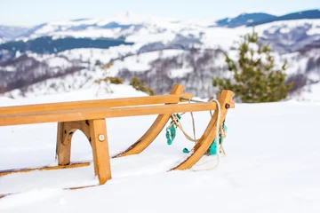 Tafelkleed Wooden sleds on snow covered mountain © creativefamily