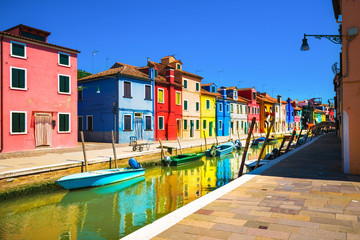 Venice landmark, Burano island canal, colorful houses and boats, Italy