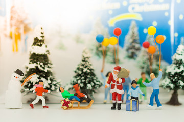 Miniature Santa Claus and children happy feeling on Christmas day.