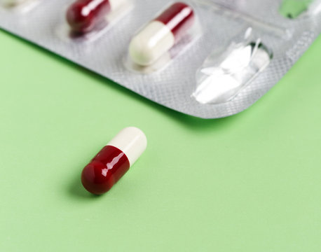 White-red capsules and foil pills blister pack