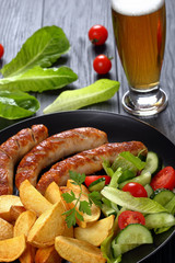 grilled bratwurst, salad, potatoes and beer