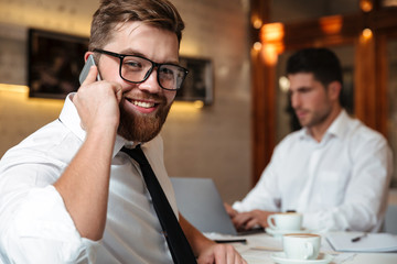 Fototapeta premium Portrait of a smiling bearded businessman
