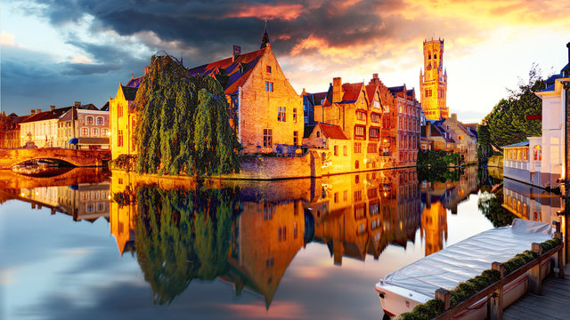 Belgium - Bruges,  Rozenhoedkaai with Perez de Malvenda house and Belfort van Brugge at sunset