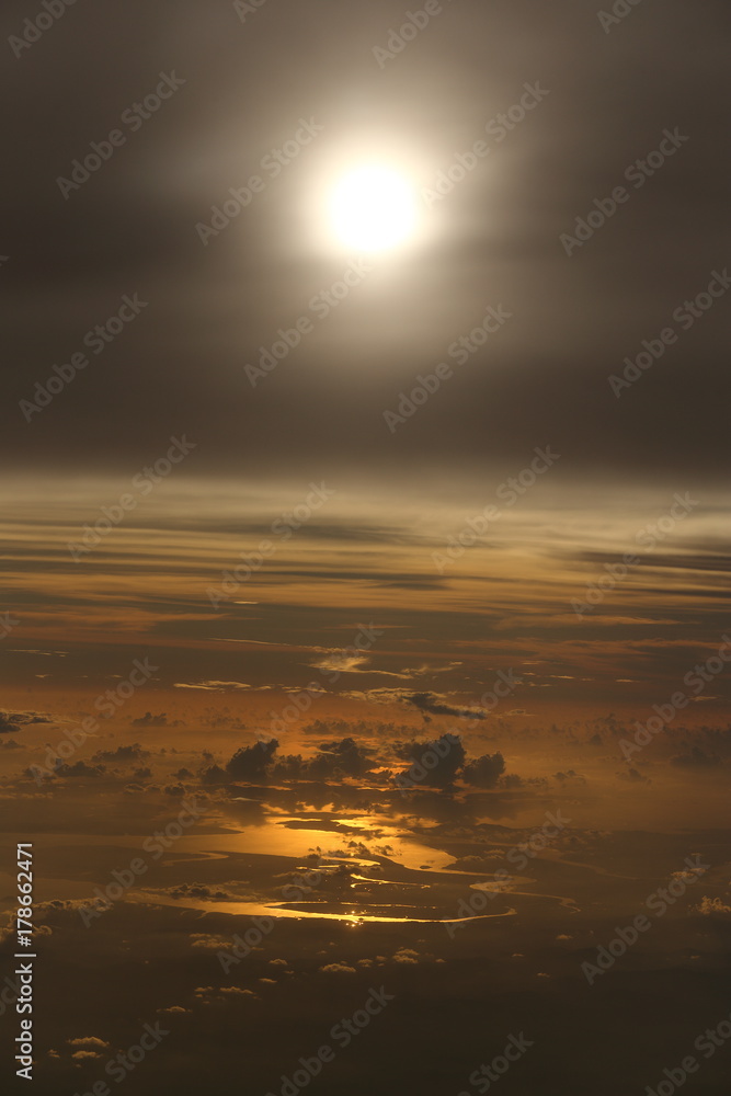 Wall mural sunset white cloud sky at high level attitude, view from window airplane